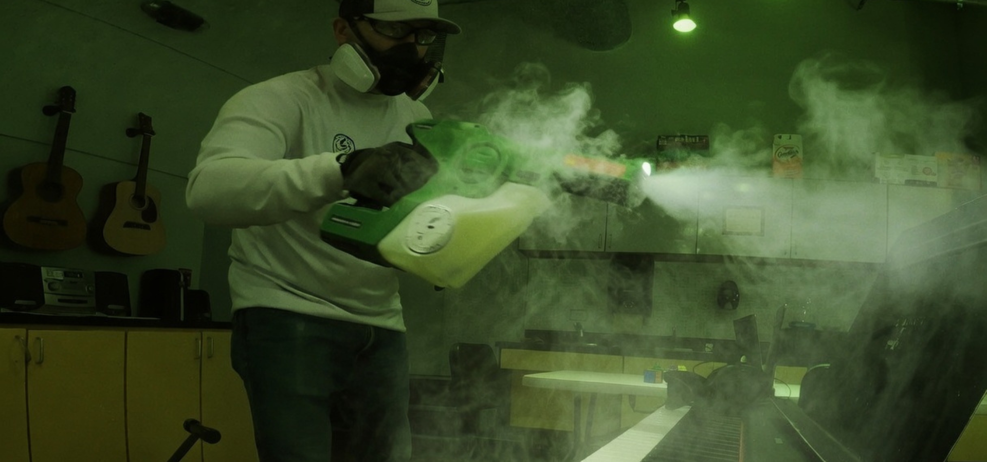 Electrostatic fogging service disinfecting a classroom for safer indoor use